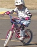 Chloe riding a bike